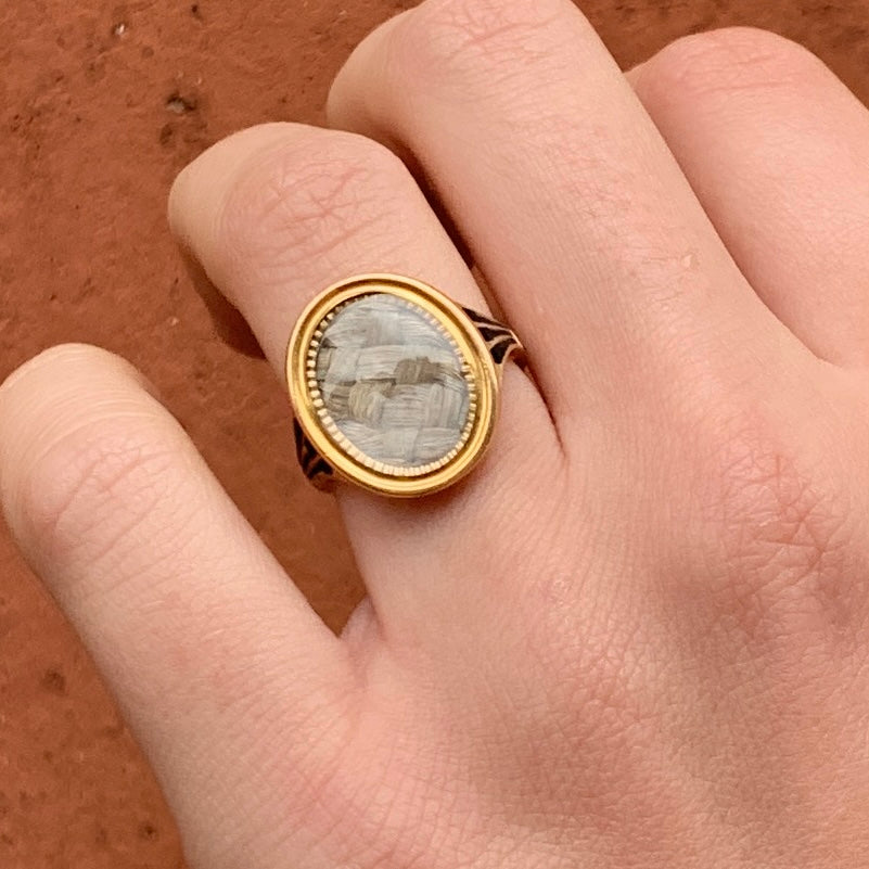 18th-century mourning ring with hairwork and enamel in 15ct gold, commemorating F.M. Tatton born in 1777.