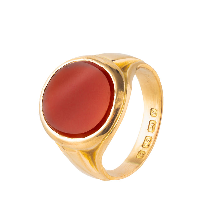 1940s English signet ring in solid 18ct gold with oval flat cut carnelian and full 1948 hallmarks, side angle view.