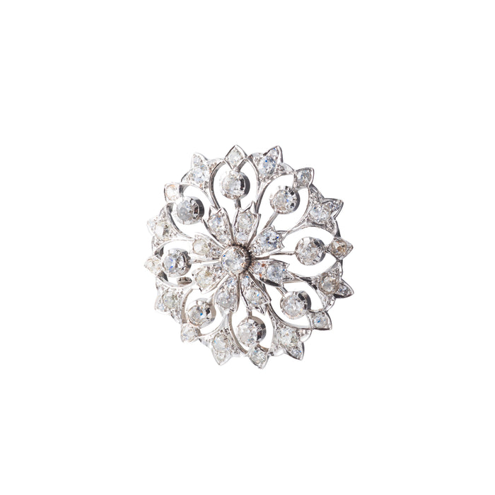 Elegant 1950s English brooch in 18ct gold with 4.5 carats of I-J colour SI clarity diamonds in an open floral motif.