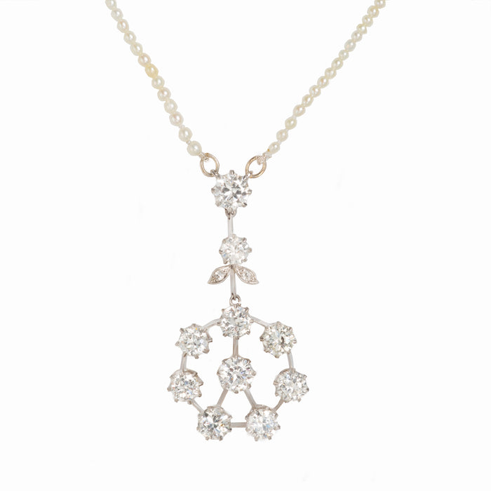1950s diamond pendant necklace with 5.5ct floral drop in 18ct gold, on seed pearl strand, close-up view
