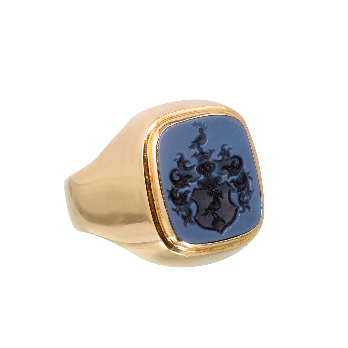 Antique 1930s German 14ct gold signet ring with carved sardonyx intaglio showing heraldic coat of arms, front view.