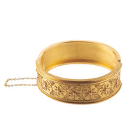 Side view of antique 15ct gold Etruscan Revival bangle showing solid hinge, clasp, and safety chain, Chester 1867.
