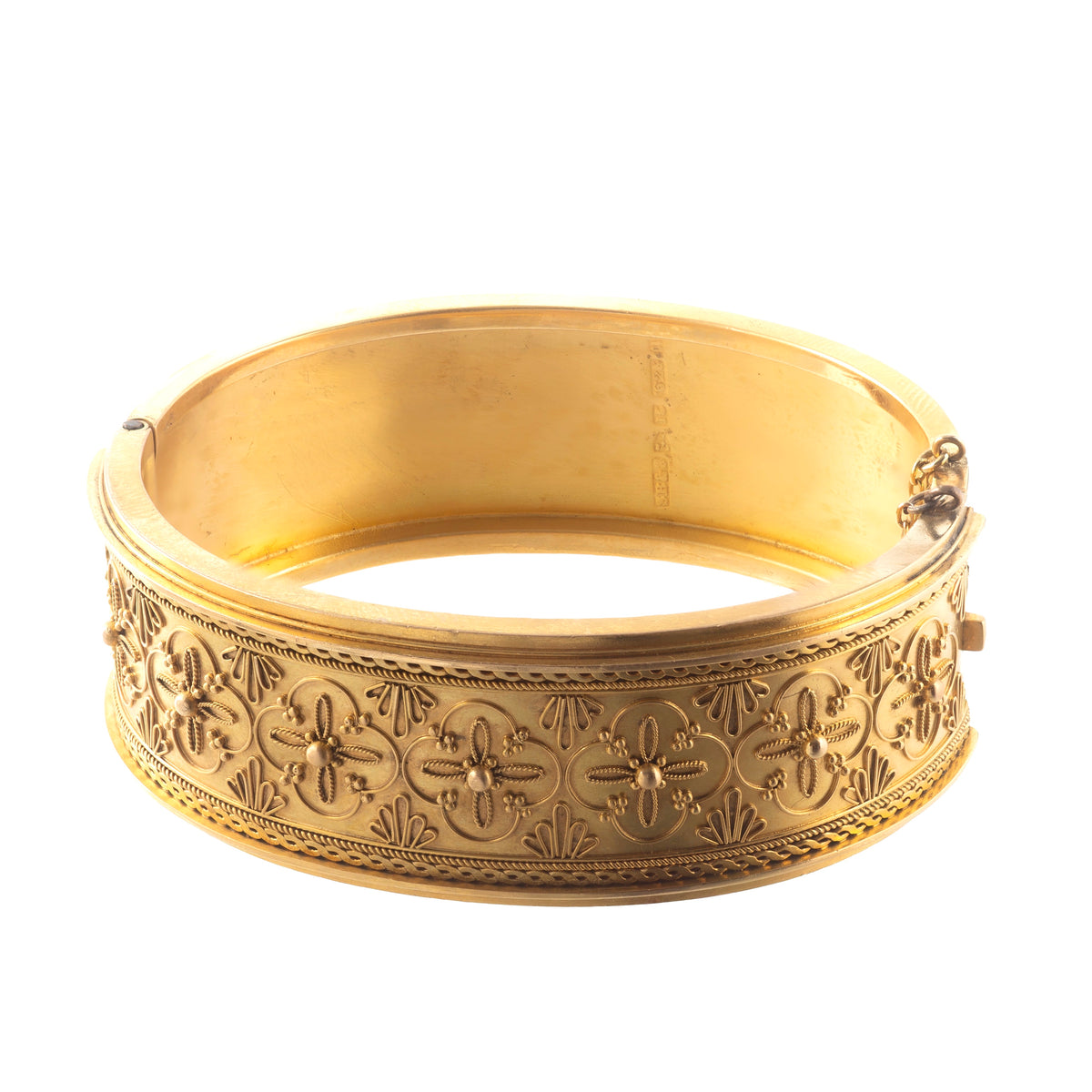 Detailed view of Victorian 15ct gold bangle with applied granulation, ropework, and engraved rosette motifs, hallmarked Chester 1867.