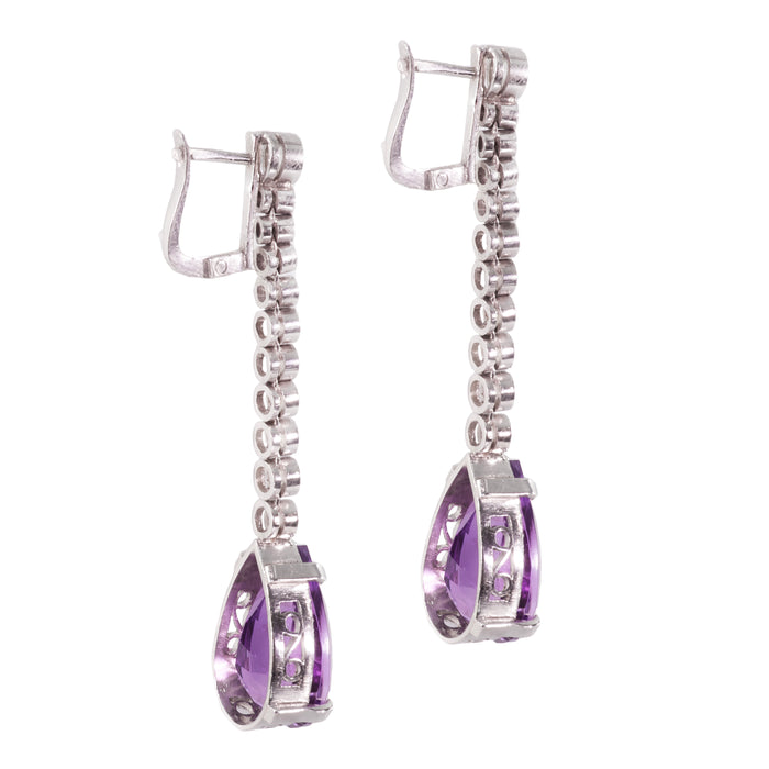 Back view of 1930s Art Deco platinum drop earrings with large pear cut amethysts and diamond line setting