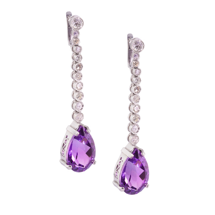 Front view of Art Deco 1930s drop earrings in platinum with pear cut amethysts and old cut diamonds