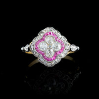 Front view of 1920s Art Deco ring with ruby surround and diamond cluster, platinum and 18ct gold setting.