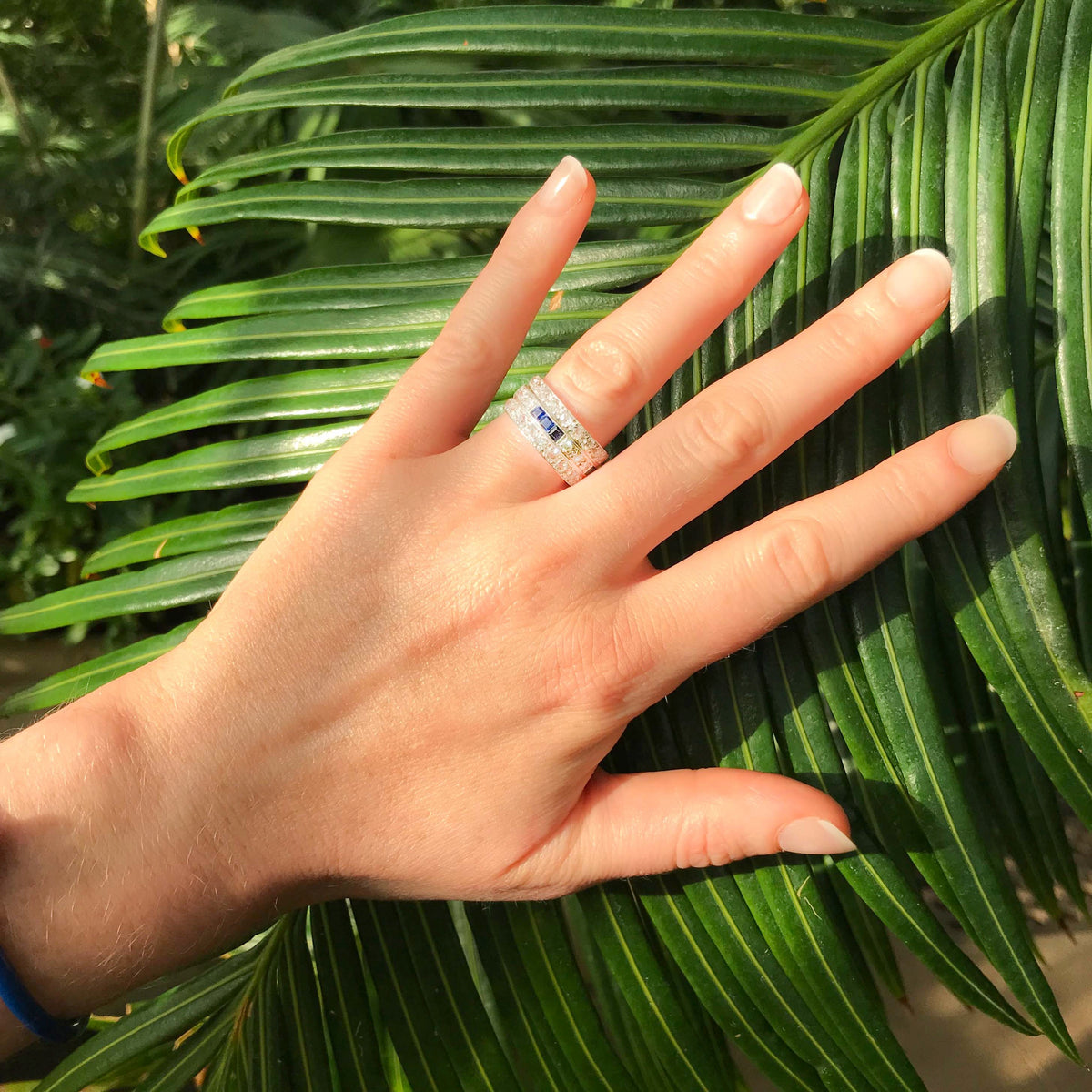 Antique Art Deco ring in 18ct gold with sapphires and diamonds shown on hand