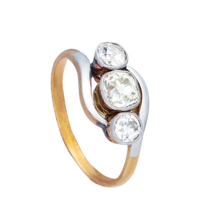 Side view of 1930s Art Deco three stone diamond twist ring showing platinum twist and 18ct gold shank.