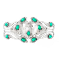 Closed view of Art Nouveau silver bat buckle c.1920, with flowing design and green chrysoprase cabochons set around a stylised bat.