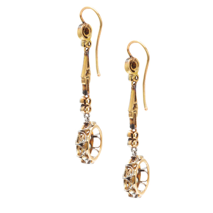 Side profile of Belle Époque diamond and sapphire earrings, c.1910s, with articulated drops and platinum millegrain detailing.