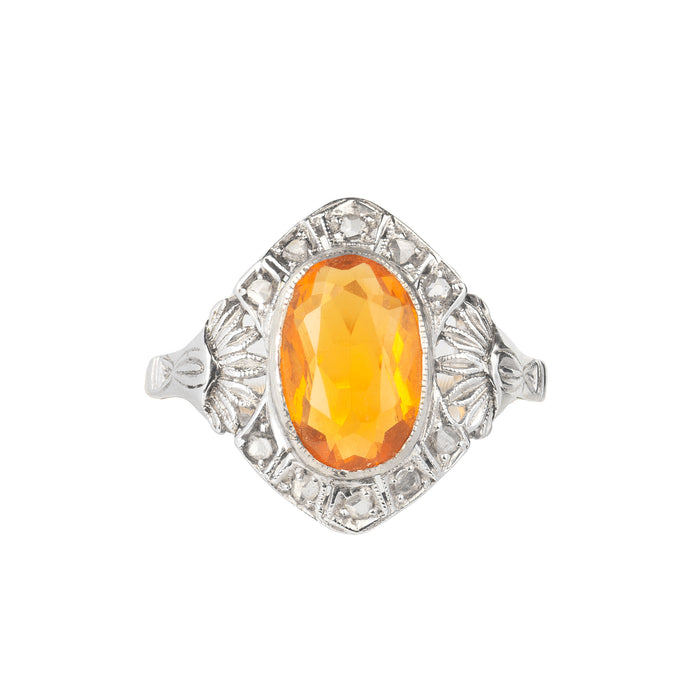 Front view of Calderoni fire opal and diamond ring c.1950s, 18ct gold with platinum top, featuring 1.25ct orange fire opal and rose cut diamonds.