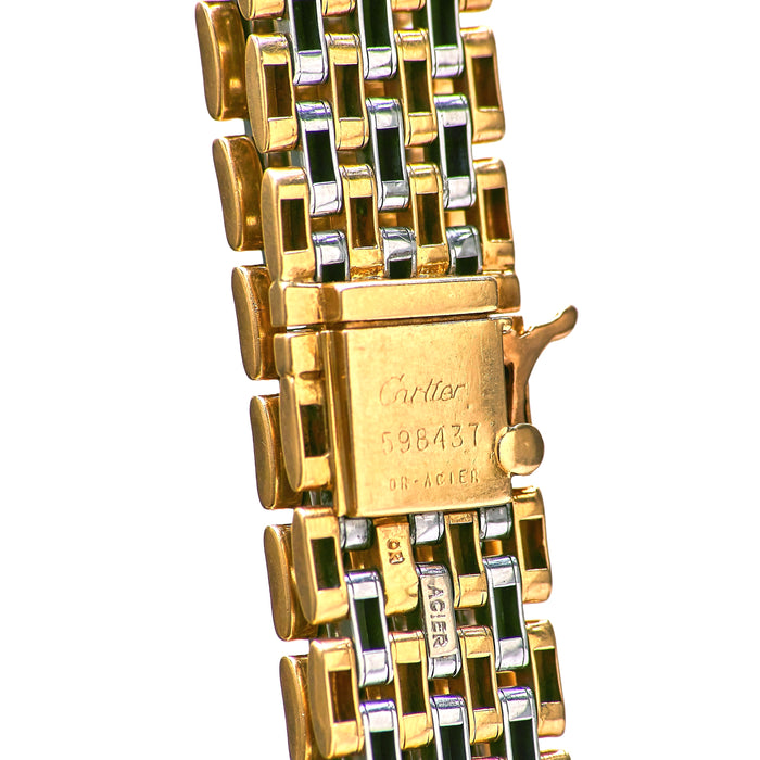 Close up of Cartier Panthère bracelet clasp showing Cartier signature, serial number 598437, French hallmarks, and gold steel construction