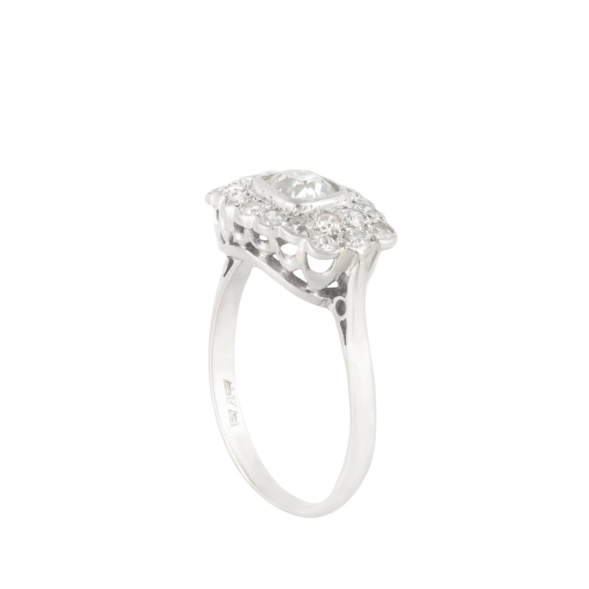 Side profile of 1940s platinum diamond cluster ring showing openwork under-gallery and scalloped diamond set edge.