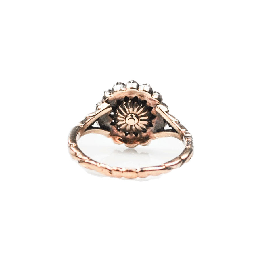 Back of 1820s Dutch rose cut diamond cluster ring showing engraved shoulders and pierced gallery.