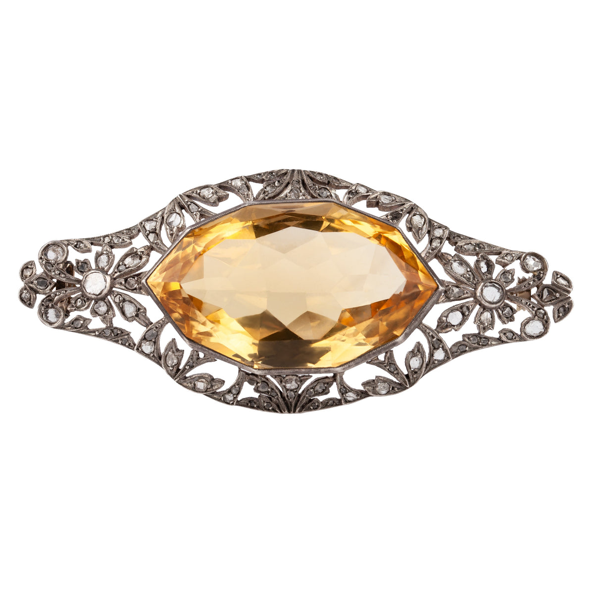 Front view of Edwardian brooch with 100ct navette citrine in pierced silver, set with rose cut diamonds and gold pin, circa 1900.