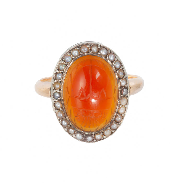 Edwardian 9ct gold scarab ring, c.1900s, carved carnelian with seed pearl halo, front view