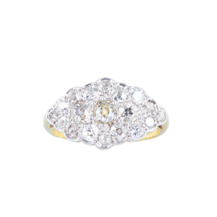 Front view of Edwardian diamond cluster ring in platinum and 18ct gold, set with nineteen old cut diamonds.