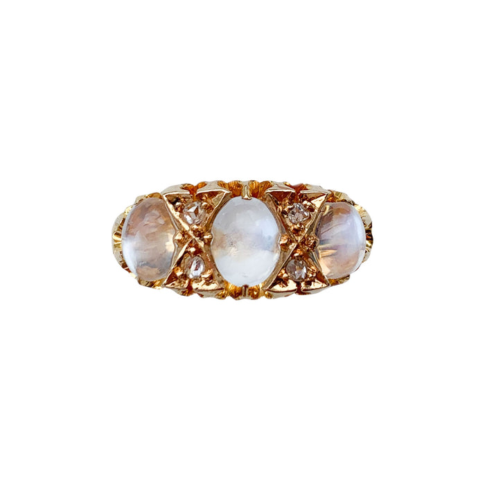 Front view of an Edwardian moonstone and diamond ring c.1901 in 18ct gold, set with three cabochon moonstones and four old mine cut diamonds.