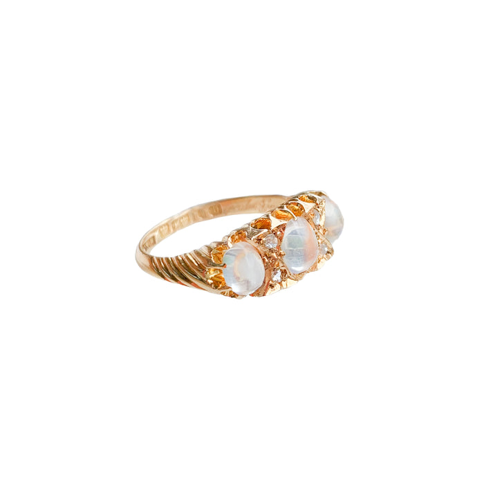 Side profile of Edwardian moonstone and diamond ring c.1901, showing domed cabochon moonstones and old mine cut diamonds in an 18ct gold band.