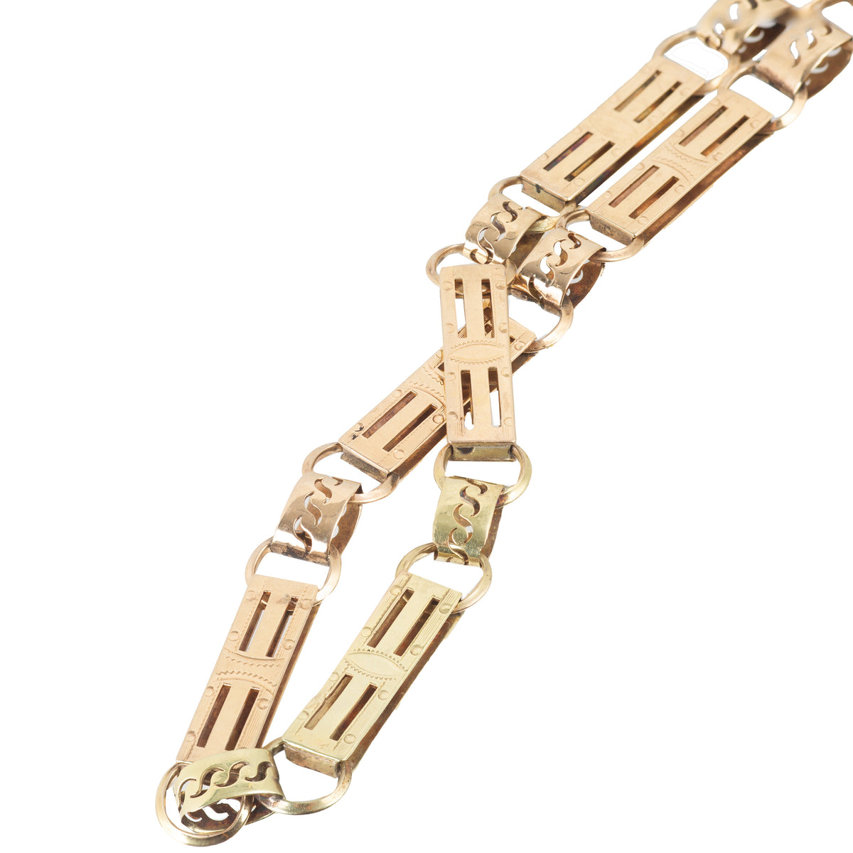 Close up view of 14ct gold fancy link chain showing detailed rectangular engraved links and figure eight connectors, European circa 1980s.