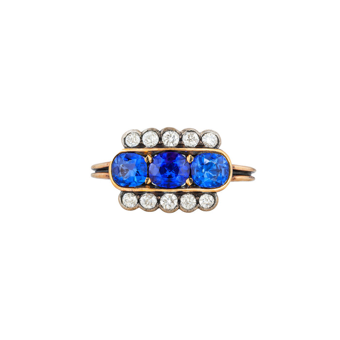 Art Deco sapphire and diamond rectangular ring in 18ct yellow gold with three Ceylon sapphires and old cut diamonds, English c.1920s, front view.