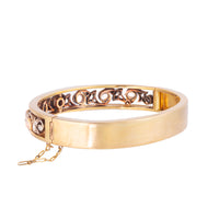 Belle Époque 18ct gold bangle with cabochon moonstones and old cut diamonds, French c.1880s, shown in side profile.