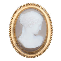 Front view of a French hardstone cameo brooch c.1860s, carved agate portrait of a lady in Greco Roman style, set in an 18ct gold Etruscan Revival frame.