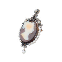 Side view of a French 18ct gold hardstone cameo brooch/pendant c.1860, set with pearls and rose cut diamonds, with eagle’s head hallmark.
