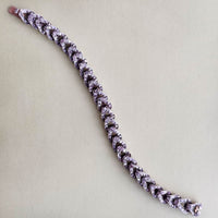 French 18ct rose gold curb bracelet, c.1880s, with rose cut diamonds, shown laid flat to display length and clasp.