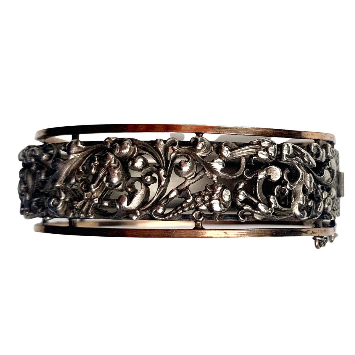 Front view of French Art Nouveau silver bangle, c.1890s, with pierced foliate motif and silver gilt borders.
