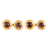 French 18ct gold cufflinks with cabochon garnets and rose-cut diamonds, early 1900s, front view.