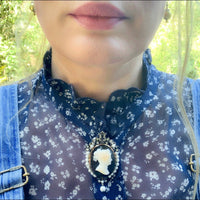 French 18ct gold cameo brooch/pendant c.1860 shown worn, featuring a classical hardstone cameo framed by pearls and diamonds.