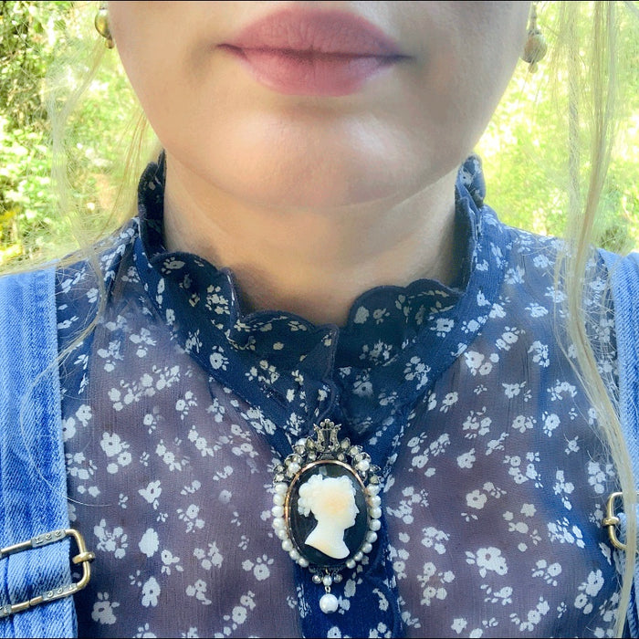 French 18ct gold cameo brooch/pendant c.1860 shown worn, featuring a classical hardstone cameo framed by pearls and diamonds.