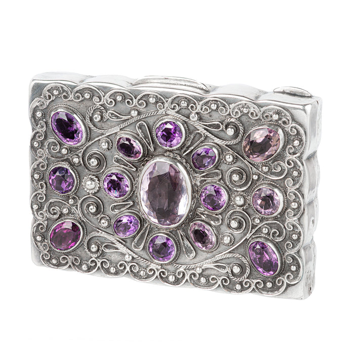 Front view of an antique French silver pill box set with amethysts, c.1880