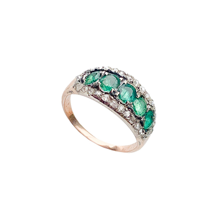Side profile of Georgian emerald and diamond cluster ring c.1820, silver-topped gold setting with candlelight sparkle.