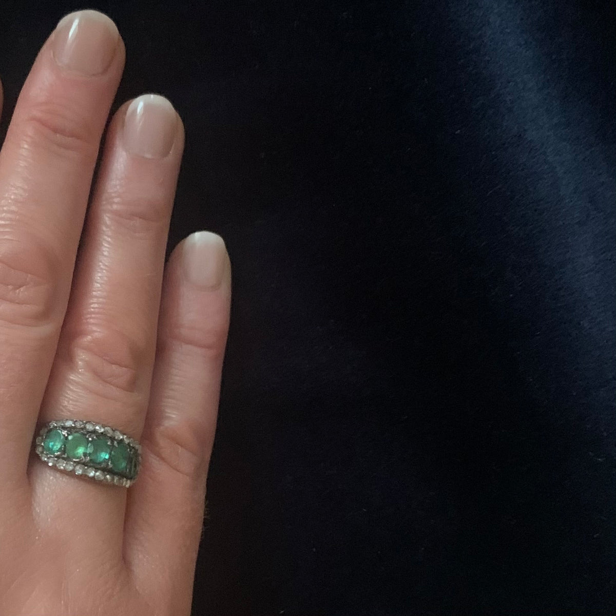 Antique Georgian emerald and diamond ring c.1820 shown worn on hand, emeralds and rose cut diamonds in 18ct gold and silver.