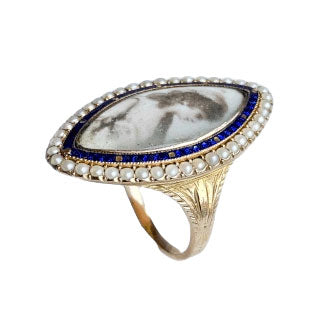 Top view of Georgian navette mourning ring, portrait miniature under glass, cobalt blue enamel surround and natural seed pearls, c.1800.