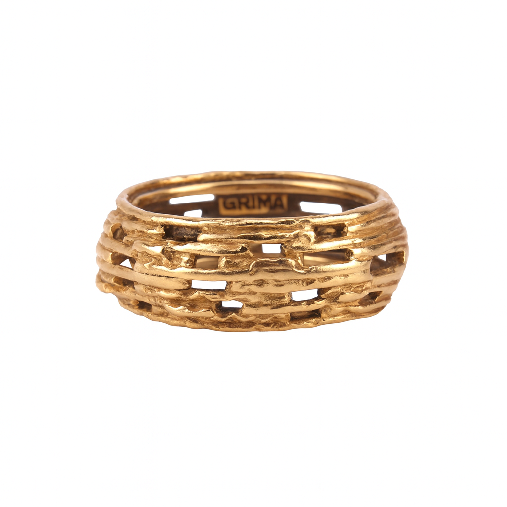 Front view of a vintage 18ct gold textured ring by Andrew Grima, showing the sculptural openwork design characteristic of the 1970s.