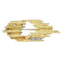 Andrew Grima brooch in textured 18ct gold with lozenge form and three single-cut diamonds, English c.1970