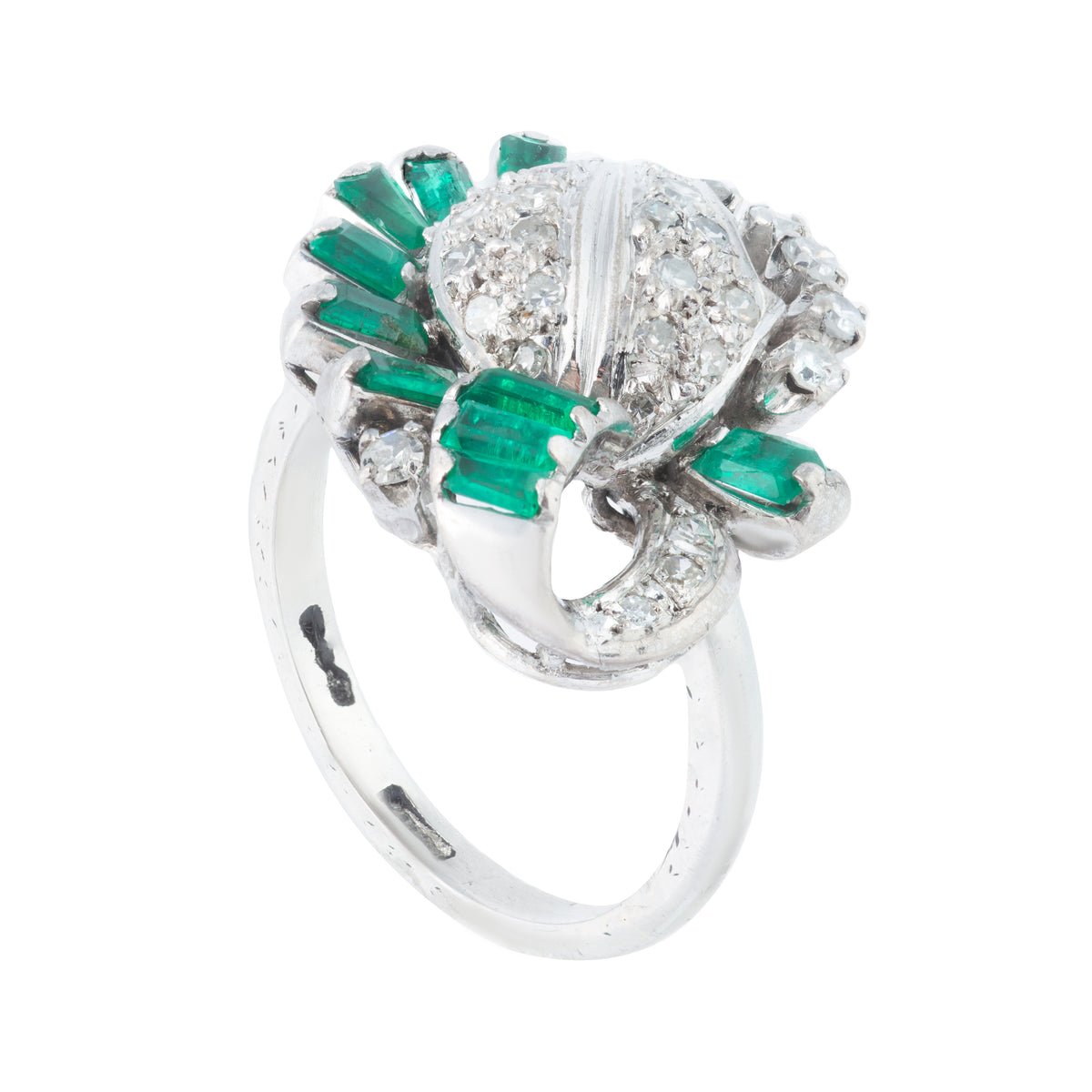 Vintage mid century emerald and diamond ring c.1950s, platinum mount with pavé diamond leaf motif and emerald surround, side view.