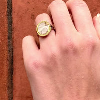 Side view of Georgian mourning ring featuring enamel detailing and personal inscription on gold band.