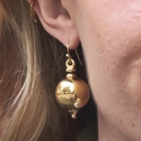 Model wearing vintage 1960s French 18ct gold ball drop earrings, 3.5cm length