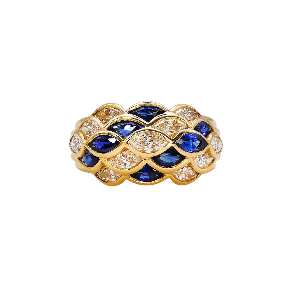 1940s sapphire and diamond dome ring in 18ct gold with navette cut design, featuring eight sapphires and twelve diamonds.