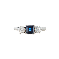 Vintage 1940s platinum ring set with a square blue sapphire and two round brilliant diamonds, classic three stone design made in England.