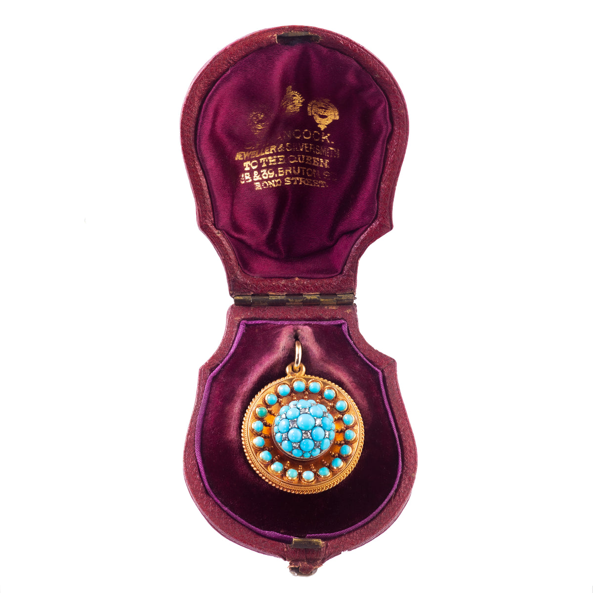Antique turquoise and diamond gold locket by Hancocks of London, c.1880s, displayed in its original fitted box.