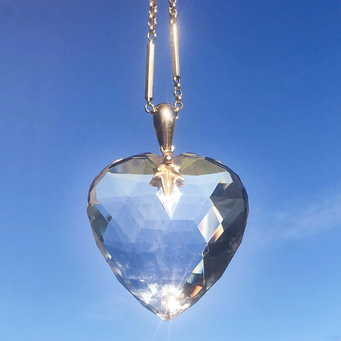 Victorian 9ct gold guard chain shown with suspended rock crystal heart pendant, c.1880.