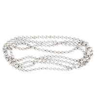 Coiled view of a Victorian silver ball necklace, English c.1880s, 110cm long strand of silver beads weighing 60g.