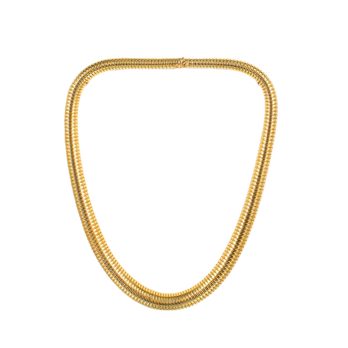 Vintage 18ct gold Tubogas necklace, England c.1980s, full view laid flat showing its coiled collar design.