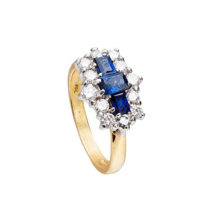 Side profile of vintage sapphire and diamond cluster ring, 18ct gold with platinum top, boat shaped design with sapphires and diamond accents.