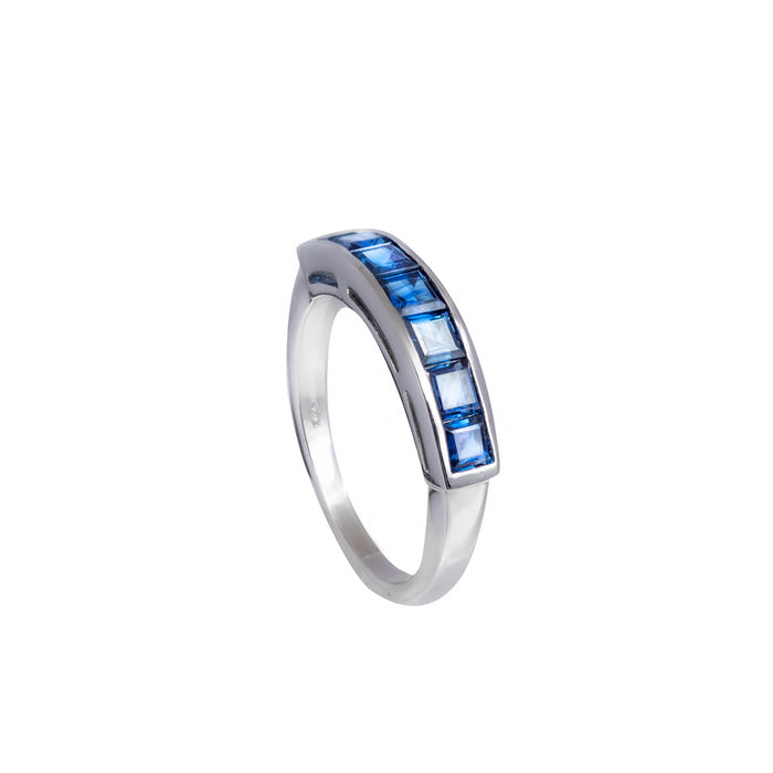 1970s half hoop sapphire ring in 18ct white gold with square-cut channel-set sapphires, shown on white background and worn on hand.